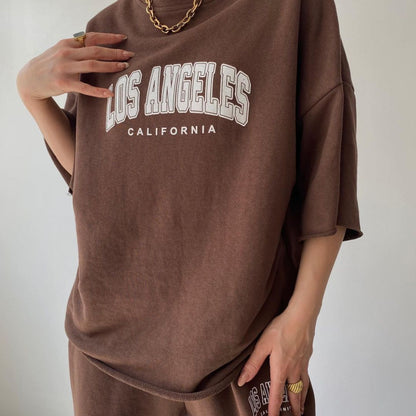 Conjunto de sudadera y pantalones de manga corta con estampado de letras y nombre de ciudad para mujer