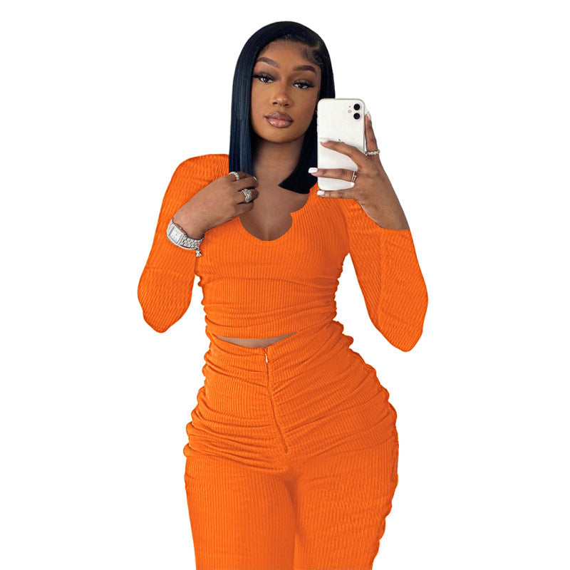 Conjunto deportivo de dos piezas para mujer: top de manga larga con cuello en U y pantalón plisado