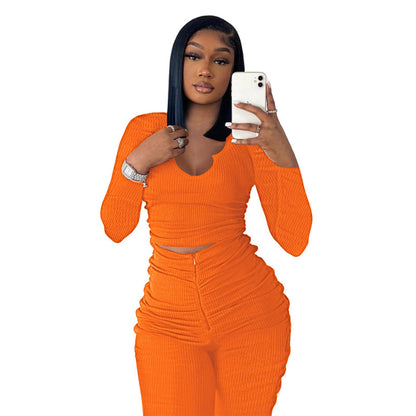 Conjunto deportivo de dos piezas para mujer: top de manga larga con cuello en U y pantalón plisado