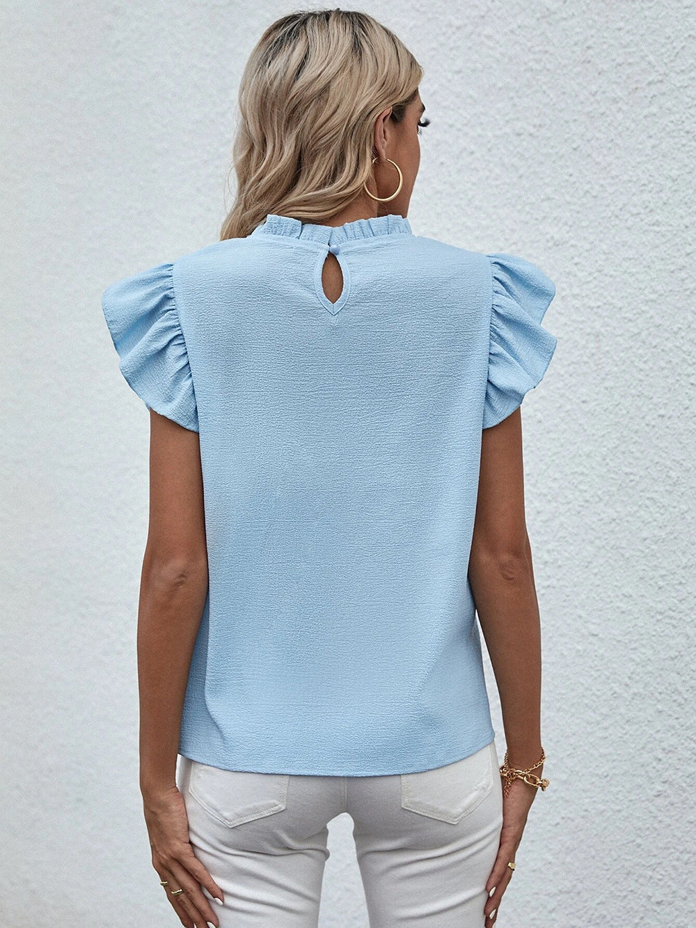 Blusa informal sin mangas con cuello redondo y volantes de color liso a la moda para mujer